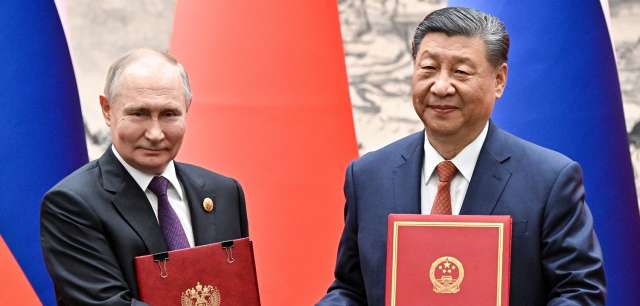 Китайският президент Си Дзинпин и руският президент Владимир Путин осъдиха
